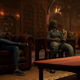 Iron Man and the Hunter play video games on the couch.